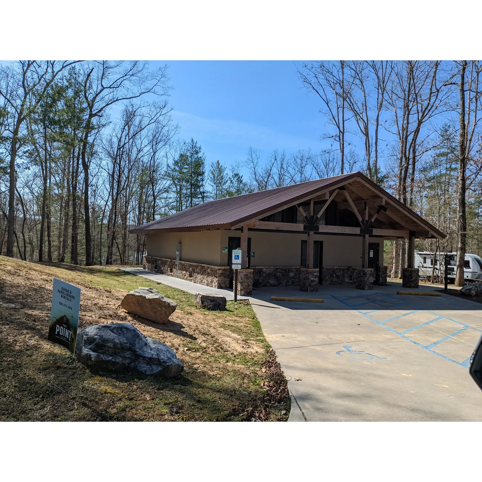 Morganton Point Campground is a serene paradise for outdoor enthusiasts, where tranquility and nature converge to create an idyllic getaway. With spacious campsites available even toward the end of the season, guests can embrace the peace and quiet, allowing for restful days, lively campfires under the starlit sky, and ample space to unwind. Embodying the spirit of hospitality, the campground hosts, like Diana and RD, consistently receive praise for their friendliness and dedication to ensuring that visitors have a memorable and comfortable stay.

Guests can select from a variety of campsites according to their preferences, with options ranging from secluded tent sites to accommodating RV spots, some featuring convenient amenities such as water and electric hookups. The tranquil wooded setting on the shores of Lake Blue Ridge offers an immersive nature experience with select sites offering breathtaking lake views directly from your campsite. Regardless of the campsite chosen, standard comforts like picnic tables and fire pits are thoughtfully provided at each location.

Hygiene and cleanliness are top priorities, evident through the consistently maintained and modern facilities. The new bathhouse is applauded for its cleanliness, offering warm showers and contemporary conveniences that bring a touch of home to the outdoor experience. Even during the colder months, guests can appreciate the heated bathrooms equipped with multiple stalls, showers with benches and hooks, and accommodations for those with accessibility needs.

Beyond the individual campsites, the campground boasts of additional features and recreational opportunities. There are picturesque walking paths, perfect for exploration and soaking in the surroundings. During the summer months, visitors can enhance their lake experience with kayak and stand-up paddleboard rentals, easily accessible via a scenic walk to a nearby shack.

With its commitment to cleanliness, exceptional guest services, and a diverse selection of camping options, Morganton Point Campground is not just a destination but an experience that beckons nature lovers to return and discover more with each visit. Description by ChatGPT.