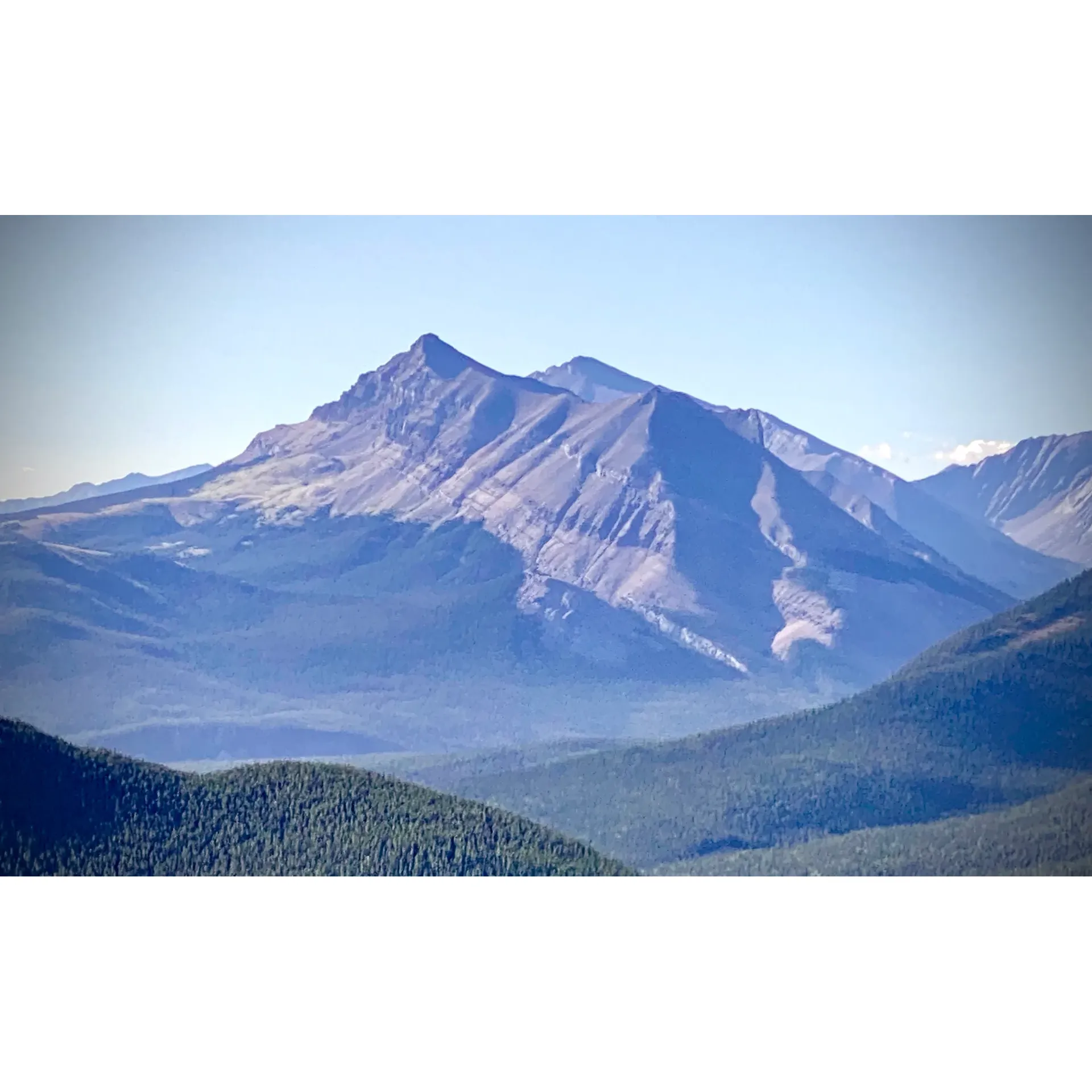 Threepoint Mountain is a majestic peak located within the Kananaskis region of Alberta, Canada. Standing at an elevation of approximately 2,165 meters, it offers stunning panoramic views of the surrounding landscape, including vast forests, rocky terrain, and distant mountain ranges. The mountain is a popular destination for hikers and outdoor enthusiasts looking to experience the beauty of the Canadian Rockies.

The trail leading to Threepoint Mountain is a challenging yet rewarding trek, suitable for intermediate to experienced hikers. The route is approximately 19 kilometers round trip, with a steep incline and rocky terrain in some sections. Hikers can expect to encounter diverse flora and fauna along the way, adding to the natural beauty of the area. It is important for visitors to come prepared with proper hiking gear, including sturdy footwear, plenty of water, and a map or GPS device.

Threepoint Mountain is situated within the Kananaskis Country region, known for its recreational opportunities, including hiking, camping, and wildlife viewing. The area is easily accessible by car, with a parking lot located at the trailhead. Hiking to the summit of Threepoint Mountain provides a challenging yet rewarding experience for outdoor enthusiasts seeking to explore the stunning wilderness of Alberta's Rocky Mountains. Description by ChatGPT.