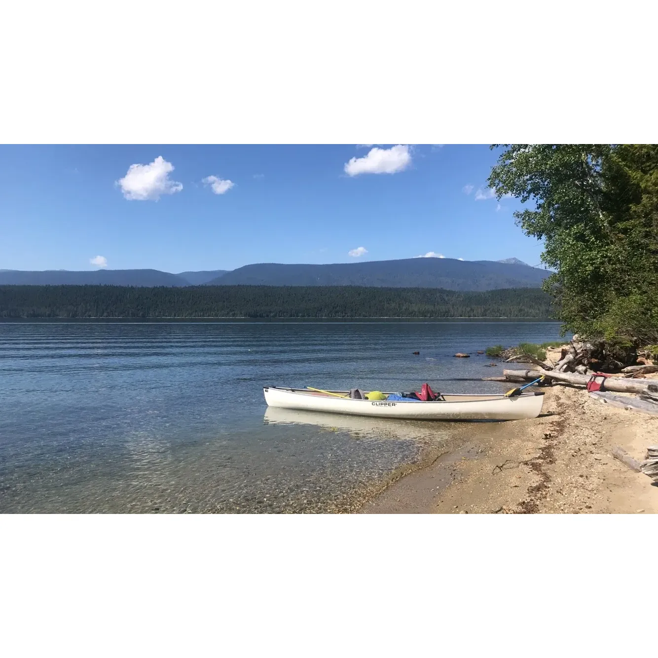 Huckleberry Campground offers an idyllic retreat for those looking to immerse themselves in the tranquility of nature. Set on the scenic shores of Clearwater Lake, the campground is a haven for outdoor enthusiasts and families alike. Visitors are greeted with the stunning spectacle of the evening sun casting golden hues across the pristine waters, creating a perfect backdrop for any camping experience.

The campground boasts a picturesque sandy beach that is perfect for swimmers of all ages. Whether you're looking to cool off on a hot summer day or simply relax on the shore, the beach provides a serene escape from the bustle of everyday life. The ample tree coverage ensures privacy and a sense of seclusion, adding to the peaceful ambiance that Huckleberry Campground is celebrated for.

Consistently acclaimed as one of the finest campgrounds on Clearwater Lake, the site offers guests the opportunity to witness the natural beauty of the area. The sense of serenity that permeates through the campground is palpable, making it an ideal spot for those seeking a tranquil getaway. Accessibility is a highlight, as the allure of this hidden gem is heightened by the adventure of discovering its secluded setting.

With its unparalleled combination of natural beauty, privacy, and recreational opportunities, Huckleberry Campground stands out as a premier destination for camping adventures. It invites you to unwind amidst the splendors of nature and create cherished memories on the shores of Clearwater Lake. Description by ChatGPT.