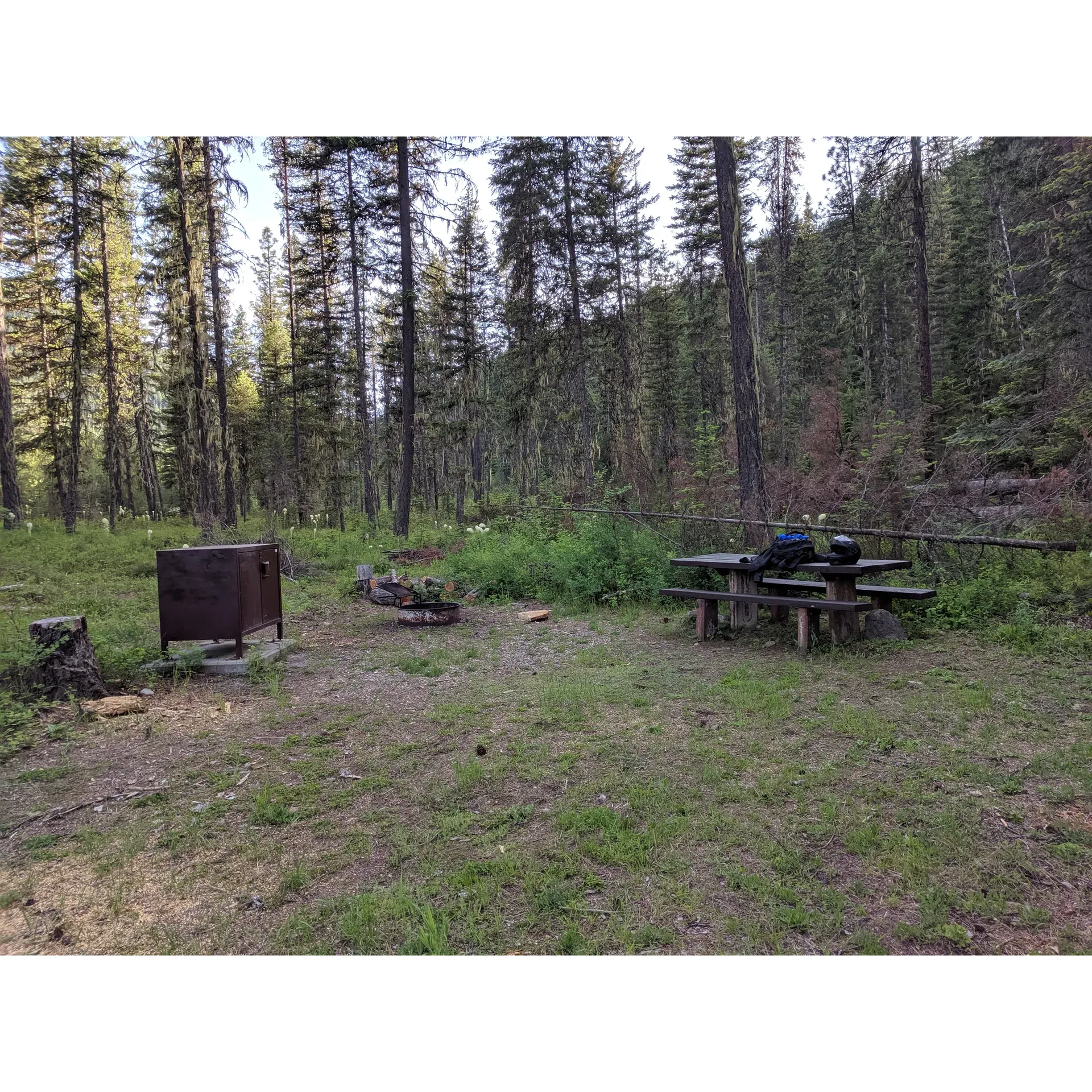 Jackpine Flats Campground offers a tranquil escape into the serenity of nature, providing guests with a quaint and picturesque setting for their outdoor adventures. The soothing sounds of the nearby creek offer a natural lullaby for campers at night, enhancing the peaceful and quiet atmosphere that envelops the area.

For the convenience and safety of guests, each campsite is equipped with a bear-proof box to secure food items, ensuring an undisturbed experience with local wildlife. Campers can enjoy the simple pleasures of outdoor living with amenities such as a fire ring, perfect for cozy campfires under the starry sky, and a picnic table to gather around for meals or socializing.

The single available campspot offers a sense of exclusivity and privacy, ideal for those looking to disconnect from the hustle and bustle of daily life. The accompanying facilities are well-maintained, providing a decent and stocked bathroom to cater to the basic needs of guests.

Jackpine Flats Campground is an attractive destination for those in search of a low-key retreat amidst the natural beauty of the landscape, complemented by the charming presence of a babbling creek. This hidden gem, while a bit off the beaten path, is the embodiment of a sweet and pleasantly nice camping experience. Description by ChatGPT.