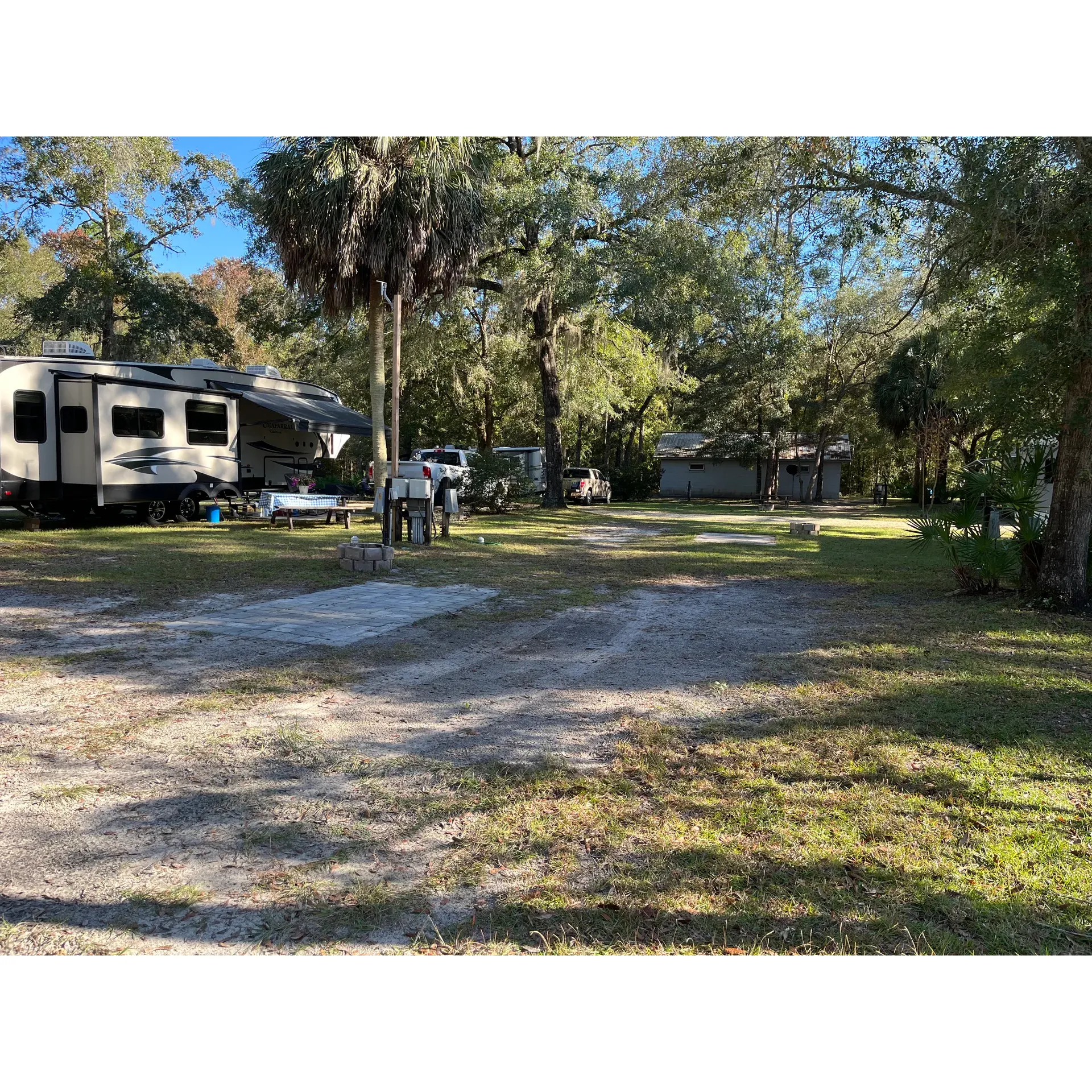 Escape to a tranquil oasis in the heart of nature at Suwannee River Hideaway Campground, where serene surroundings await to provide the ultimate camping retreat. Picture yourself unwinding by a picturesque pond, ensconced in lush greenery, with an array of sites offering ample privacy and space. Delight in the verdant beauty as you stroll through the abundant trees and flowers that adorn the campground, enhancing the sense of peace and seclusion.

Take advantage of the campground's amenities, including a refreshing pool to cool off on a warm day, a well-maintained and scenic hiking path that meanders along the majestic Suwannee River, and a captivating boardwalk that guides you through the enchanting cypress swamp. As dusk settles, the air comes alive with the mystical calls of owls, providing a soothing backdrop to your evening.

The community space is a welcoming hub where guests can relax on cozy couches, engage in fun games, immerse themselves in a good book, or cook up a storm in the fully-equipped kitchen. Impeccable bathrooms ensure a comfortable stay, always well-stocked and maintained to the highest standards of cleanliness.

Network with fellow campers or find solitude, as the friendly atmosphere encourages connections and greetings are shared with warmth and sincerity. For those needing to stay connected, WiFi service is available throughout the campground; while it may not be the fastest, it ensures that your essential online needs are met.

Adventurous souls will be delighted by the local wildlife, with unique opportunities to spot multiple species of woodpeckers, including the majestic pileated variety, and the elusive barred owl. Birdwatching enthusiasts and nature lovers alike will find themselves in a paradise of biodiversity.

Suwannee River Hideaway Campground provides a refreshing dose of nature's simplicity and beauty. It is the perfect destination for those seeking to recharge, indulge in nature's wonders, and enjoy a camping experience that pleasantly exceeds expectations. Whether for a spontaneous night under the stars or a longer stay to fully embrace the serene setting, the campground is an inviting haven for residents and travelers alike. Description by ChatGPT.