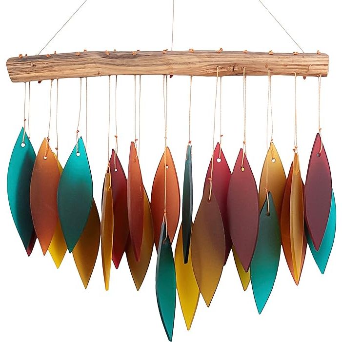 The Blue Handworks Santa Fe Glass Chime is a handcrafted wind chime made with sandblasted glass and found wood. The chime features a unique design that combines elements of nature with artistic flair, creating a beautiful and mesmerizing piece to hang outdoors.