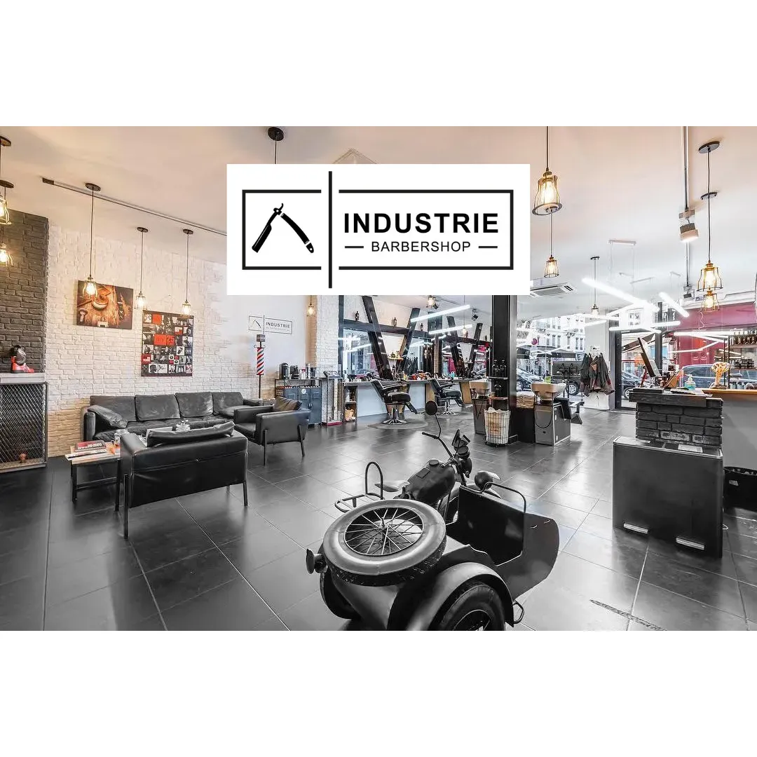 Industrie Barbershop emerges as a beacon of professionalism and impeccable service in the realm of men's grooming. Esteemed for its clean, fresh ambiance, the barbershop is a haven for those seeking not just a haircut, but an experience in the hands of profoundly skilled artisans. Clients consistently praise the talented team, highlighting barbers like Aurélien for his unmatched hairdressing finesse and Michel for his exuberant hospitality that ensures every guest is greeted with a sincere smile.

With a team fluent in both scissors and conversation, this establishment has become a cherished locale for locals and expats alike, with professionals like Nika winning over the trust of international clientele with ease. The ability to communicate effortlessly in English adds to the barbershop's inclusive charm, making everyone feel right at home.

Visitors arrive with expectations of greatness and leave with those expectations surpassed. Roxane's mastery with the tools of her trade is lauded as a consistent deliverer of top-notch styles, solidifying her reputation as the best barber many have found in Lyon. Whether it's maintaining the classic look or crafting a fresh, modern edge, the staff at Industrie Barbershop are celebrated for their attentive, personalized service.

Earning glowing recommendations, Industrie Barbershop is the destination for students, professionals, and anyone in between, seeking a refined cut and a welcoming atmosphere that ensures you'll return, time and time again. Description by ChatGPT.