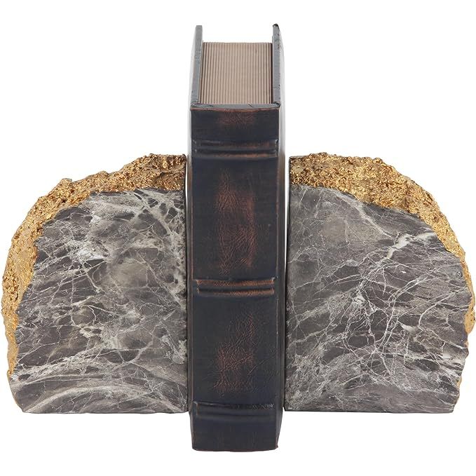 The CosmoLiving by Cosmopolitan Polystone Geode Bookends are a stylish and functional addition to any bookshelf or desktop. This set of two bookends measure 5 inches in width and 7 inches in height, making them the perfect size for holding up your favorite books.