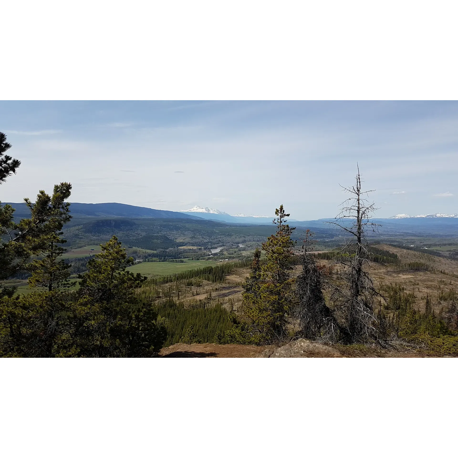 Barrett Hat Hiking Trail offers an invigorating respite for travelers and adventurers alike who seek a break from the confines of the car during long journeys. Conveniently located between PG and Terrace, this trail presents a great opportunity for a stretch and a breath of fresh air. The trail can be completed in a reasonable time frame, with an average round trip taking approximately 2 hours, even when there's a touch of snow gracing the pathway.

One of the most appealing aspects of Barrett Hat Hiking Trail is the spectacular views it provides, which are sure to captivate nature enthusiasts and photographers. Despite a challenging incline, the climactic ascent rewards hikers with breathtaking vistas and creates a sense of achievement that is well worth the effort.

The trail is not without its adaptability; for those seeking a less icy journey, especially during the colder months, there's a forest trail available that bypasses the steepest stretch. Keep an eye out for a discreet sign offering this alternative route – a hidden gem within the trail that enhances the hiking experience.

At the summit, hikers can find solace and shelter, offering a welcoming spot to rest and enjoy the picturesque surroundings. Families and adventurers, whether they've come willingly or been coaxed along, will find Barrett Hat Hiking Trail offers a delightful hike accompanied by much laughter and minimal complaints.

Whether you're an avid hiker or simply passing through, the trail promises a fulfilling outdoor activity that encapsulates the essence of the great outdoors with its excellent views and a sense of tranquil isolation from the hustle and bustle of daily life. It’s a perfect little adventure to stretch the legs and immerse oneself in the panoramic beauty of the region. Description by ChatGPT.