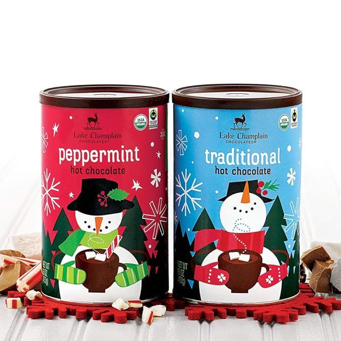 The Lake Champlain Holiday Hot Chocolate Gift Set is a premium gift option for hot chocolate lovers. The set includes 2 flavors of cocoa mix, each in a 1 pound tin, offering a total of 32 servings. The flavors included in this gift set are perfect for the holiday season and make for a cozy treat on cold winter nights.