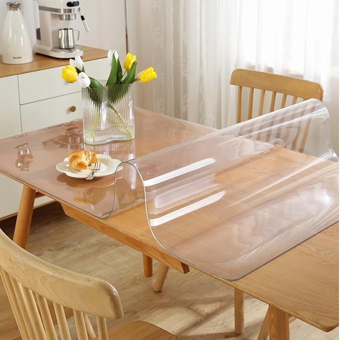 Protect and showcase the elegance of your tabletops with the OstepDecor Clear Table Protector, the perfect blend of utilitarian design and aesthetic appeal. Measuring an ample 24 x 48 inches, this crystal-clear protector is meticulously crafted from premium 1.