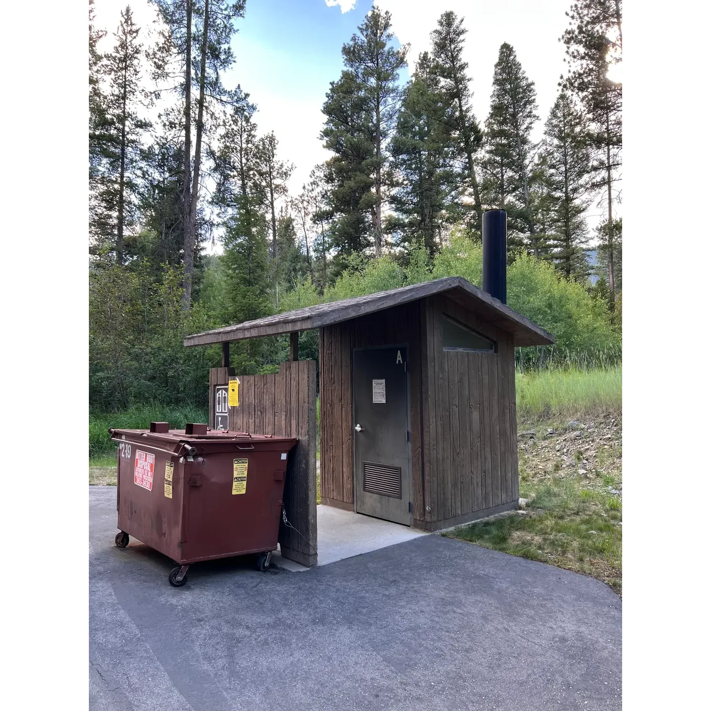 Indian Trees Campground presents an inviting retreat for nature enthusiasts seeking tranquility and the simple joys of outdoor life. This charming campground offers a series of well-spaced sites that afford privacy without isolation, allowing guests to appreciate a sense of seclusion while still feeling part of a community. Each site features large tables and fire pits, perfect for family gatherings or a cozy night under the stars.

Many campsites are adjoined by the gentle sounds of a nearby creek, creating a serene soundscape that enhances the camping experience. The background melody of babbling water serves as a natural lullaby for those who camp beside it, providing a peaceful atmosphere for rest and relaxation.

Attention to cleanliness is evident throughout the campground, with the bathrooms consistently maintained to an exceptional standard, often acknowledged as some of the cleanest facilities found in similar outdoor settings. This attention to detail extends to the camp hosts, who are not only known for their friendliness but also their wealth of local knowledge and dedication to ensuring a welcoming ambiance.

Guests are furnished with water spigots and provided buckets to extinguish campfires safely, ensuring convenience and a commitment to preserving the pristine natural environment. While hammock enthusiasts might need to select their site carefully regarding tree proximity, the overall satisfaction with the campground’s amenities remains high.

For those interested in local attractions, Indian Trees Campground is conveniently accessible by a brief gravel road off the highway and is a stone's throw away from hidden gems like the quaint, old Lost Trail Hot Springs, adding an element of adventure and relaxation to the camping trip.

Indian Trees Campground is an ideal getaway for visitors looking to connect with nature, unwind in a clean and quiet environment, and enjoy the fantastic service provided by the exceptional hosts. It delivers a memorable experience for first-time visitors and regulars alike, many of whom eagerly anticipate their next visit. Description by ChatGPT.