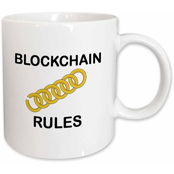 The 3dRose Coffee Mug is a 15oz ceramic mug featuring an image of bold black text that says "Blockchain Rules" with lens art by Florene. This coffee cup is part of the Crypto World collection and is a great gift for any blockchain enthusiast or cryptocurrency investor.