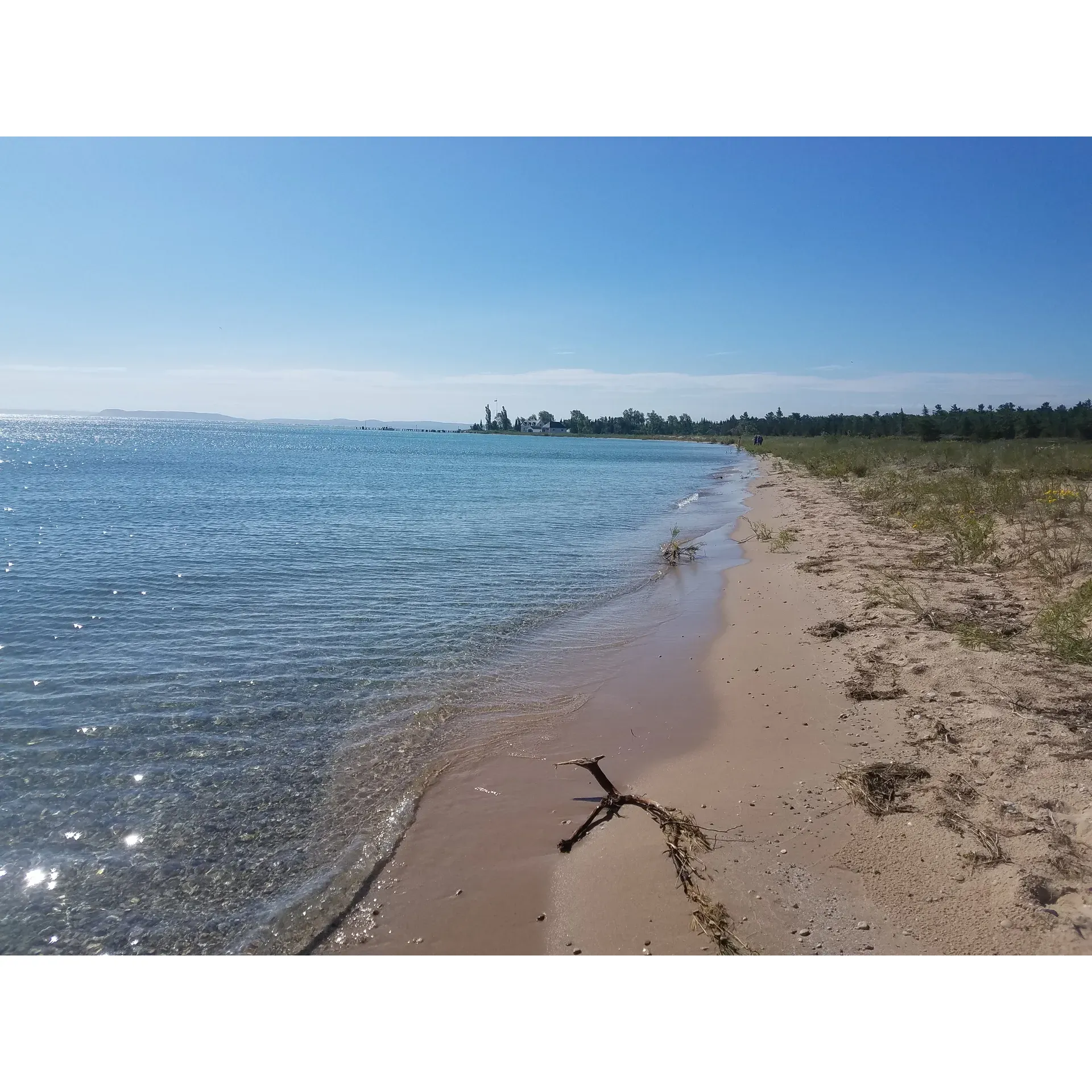 Bay Campground on South Manitou Island offers a captivating outdoor experience for campers seeking the allure of pristine nature and the tranquility of a lakeside retreat. The campground is conveniently located just a mile away from the ranger station, ensuring visitors can easily access information and assistance to enhance their outdoor adventure.

The carefully maintained campgrounds exude a sense of serenity and proximity to the lake that adds to the natural charm of the location. Visitors can look forward to days filled with exploration and picturesque views that resonate with both first-time guests and returning nature enthusiasts, many of whom highly recommend the site for its unmatched beauty and peaceful ambiance.

Campers have the unique opportunity to wake up to beautiful mornings and spend their days traversing the landscape, discovering the island's hidden gems. With camp rings complete with grates available, preparing a meal over an open fire becomes a memorable part of the experience, encapsulating the true essence of camping.

The presence of modern amenities enhances the outdoor experience. A bathroom with running water nearby provides a comfortable and convenient touch, ensuring that guests can enjoy the refreshment of modern facilities amidst their rustic getaway.

Bay Campground is a fantastic launching pad for an array of activities and explorations, allowing visitors to immerse themselves in what is often considered one of the country's hidden jewels among national parks. The friendly and helpful rangers only add to the positive experience, offering guidance and ensuring that everyone can fully embrace the captivating wonders of South Manitou Island. With the opportunity to find moments of tranquility and connect with nature, Bay Campground is the perfect destination for those seeking respite from the hustle and bustle of daily life and longing for an authentic outdoor escape. Description by ChatGPT.