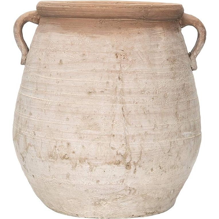 The Large Orange & Whitewashed Terracotta Urn is a stunning decorative piece that can add a touch of elegance to any indoor or outdoor space. Made from high-quality terracotta, this urn has a beautiful orange and whitewashed finish that gives it a rustic and vintage look.