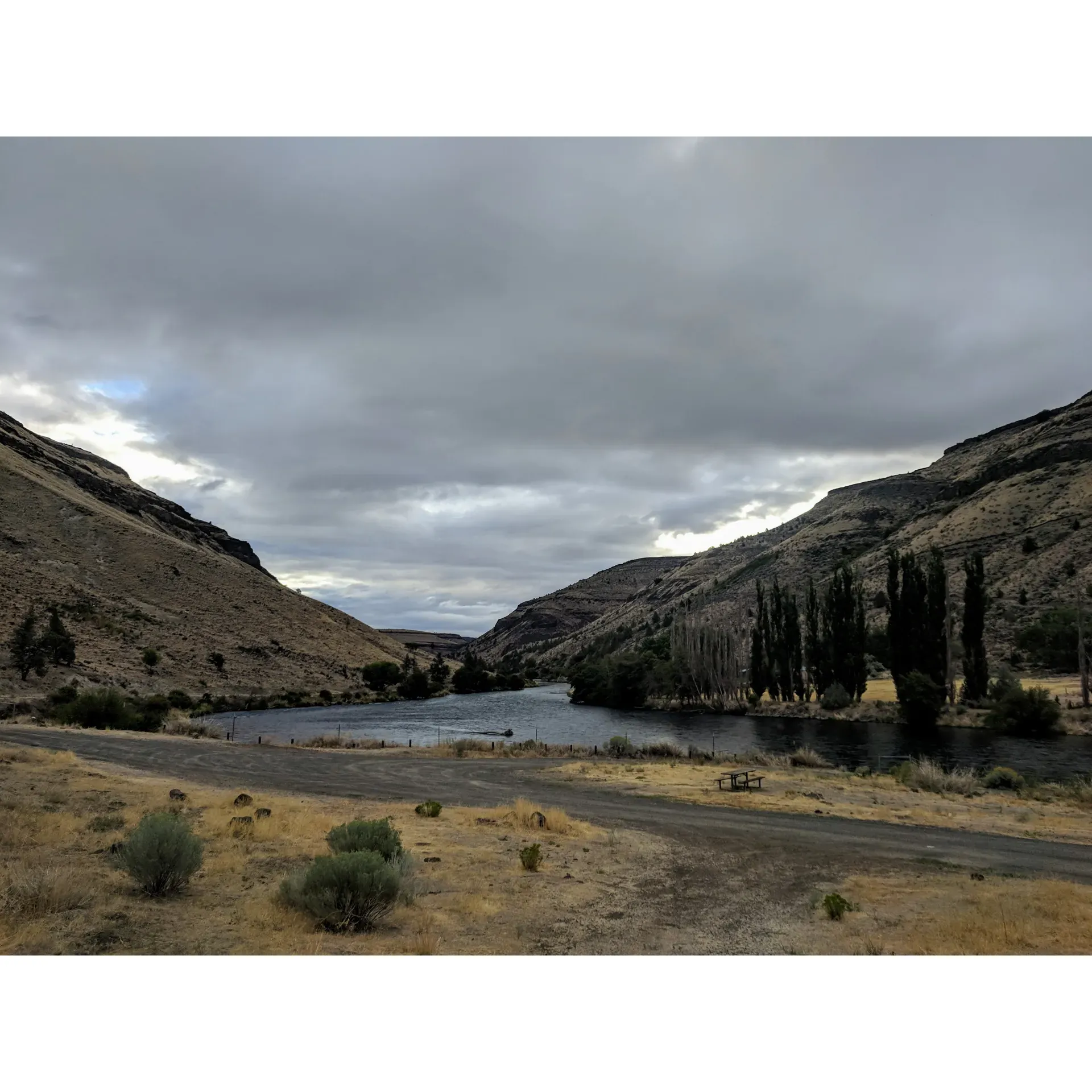 Dry Creek Campground offers a truly mesmerizing day-use area for nature lovers and outdoor enthusiasts. Visitors arrive to immerse themselves in the beautiful landscapes that the site has to offer. Framed by stunning views, it is an ideal retreat for those seeking a peaceful escape to enjoy the daytime splendor of the great outdoors.

Anglers often frequent Dry Creek Campground, taking advantage of the prime fishing opportunities available in the crisp, clear waters. The location is perfect for those looking to cast their lines in a tranquil environment, with the gentle sounds of the river creating a serene ambience.

Adventurers and day-trippers should be prepared for the rugged journey, as the road to access this hidden gem offers a hint of the untamed wilderness that awaits. Once there, visitors are treated to a quiet haven where the day can be spent in contemplation, outdoor activities, or simply soaking in the breathtaking vistas that surround this unique destination.

Guests to Dry Creek Campground should note that while the area is revered for its pristine beauty, it sits on reservation land. Hence, visitors are encouraged to obtain the necessary permits required for fishing to fully enjoy the recreational aspects of the location, while respecting the conservation efforts and the regulations instituted to preserve its natural integrity.

Dry Creek Campground is an excellent choice for day users seeking to connect with nature, indulge in a spot of fishing, or find a serene spot away from the hustle and bustle of daily life. Its pristine views and the quietude it offers make it an invaluable stop for a day filled with nature's simple pleasures. Description by ChatGPT.