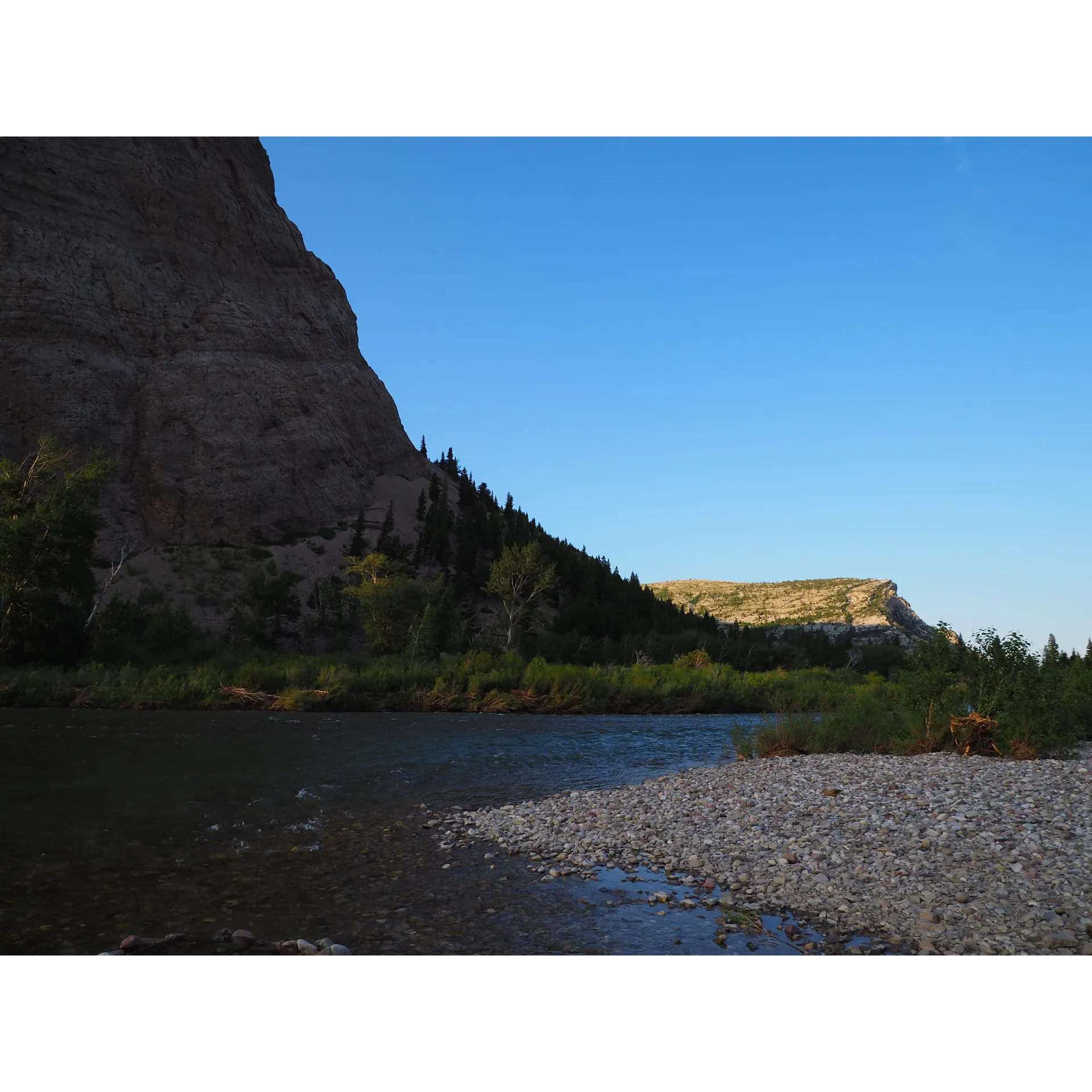 Home Gulch Campground offers an affordable outdoor eExperience at just $10 per night, where the simplicity and raw beauty of nature take center stage. Set in a picturesque landscape with stunning views of the river and reservoir, this destination is a gem in the Augusta/Choteau area. Each site promises an intimate encounter with the wilderness, surrounded by an abundance of wildlife including deer, which add to the serene and wild ambiance of the campground.

Equipped with water facilities and clean restrooms, the campground ensures basic comforts while allowing guests to immerse themselves in the environment. The proximity to Sun Canyon Lodge is a delightful bonus, providing an easy option for great food and drink just up the road.

Long-time visitors and new guests alike rave about the tranquil setting and the exceptional natural scenery that offers a sense of seclusion without being far from conveniences. The campground has garnered a reputation over the years for being a beloved spot for both short stays and extended retreats, where time seems to slow down.

Whether you're pitching your tent at one of the specially mentioned sites such as the highly recommended site 13, or choosing a spot closer to the free area, the campground offers a variety of experiences. Those seeking a memorable outdoor adventure will find Home Gulch Campground to be the ultimate getaway, often described as the "best place on earth" by those who have had the pleasure of staying here. Unwind under the vast Montana skies, take in the beautiful sights, and enjoy a stay that promises peace, beauty, and a touch of the wilderness. Description by ChatGPT.