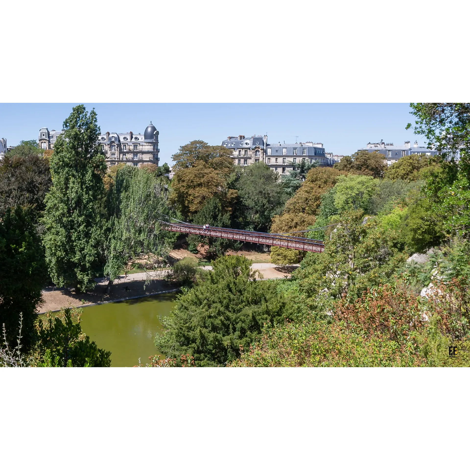 Discover an expansive oasis in the heart of Paris with the picturesque Parc des Buttes-Chaumont. Renowned for its diverse landscapes and abundant greenery, this historic park presents a variety of styles and natural settings across its generous expanse, offering an escape from the urban hustle. Visitors are delighted by the vibrant ambiance that envelops the park on sunny days, making it a favored destination for locals and visitors alike.

Visitors can immerse themselves in the park's dynamic aura that comes alive as casual walkers, runners, and families convene to enjoy the lush surroundings. An idyllic spot for picnics, peaceful jogs, or leisurely strolls, the park's inviting trails and scenic areas provide the perfect backdrop for relaxation and social gatherings. With towering old-growth trees and abundant seating areas, the park exudes a serene charm akin to a smaller, more intimate cousin of New York’s Central Park.

Although some areas are preparing for a transformation, the park's age-old beauty continues to be a magnet for those seeking an urban retreat. One can anticipate the park’s upcoming enhancements while still enjoying the rich history and lively community atmosphere prevalent throughout the green space.

A true urban sanctuary, Parc des Buttes-Chaumont is a beloved haven amidst the cityscape, offering a restorative retreat for those who visit. Its commitment to continuous improvement promises an even more enchanting experience in the future, ensuring the park remains a precious resource for the people of Paris. Description by ChatGPT.