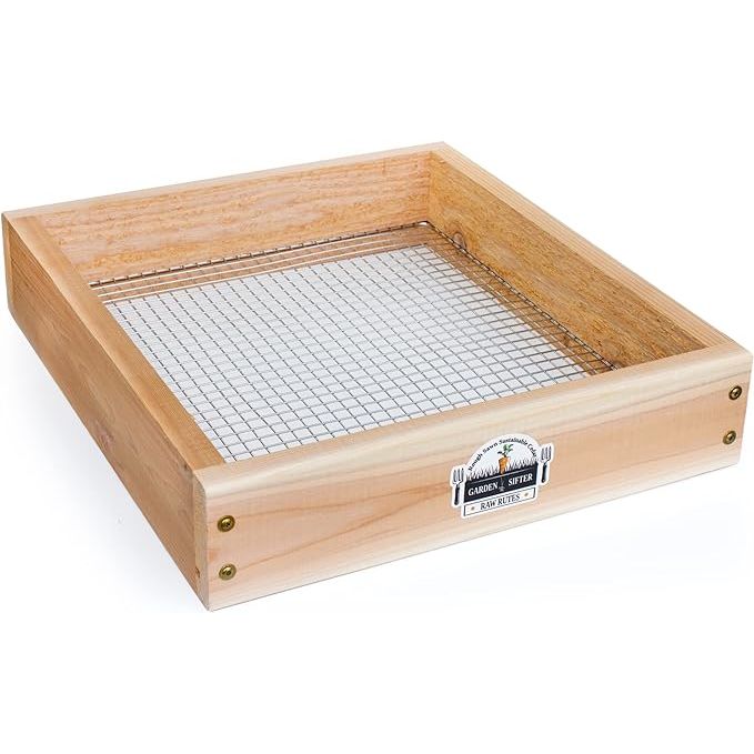 The Cedar Garden Sifter is a versatile tool designed for sifting compost, dirt, and potting soil, made in the USA using sustainable cedar wood. The heavy-duty stainless steel grate ensures durability and longevity, making it ideal for both amateur and professional gardeners.