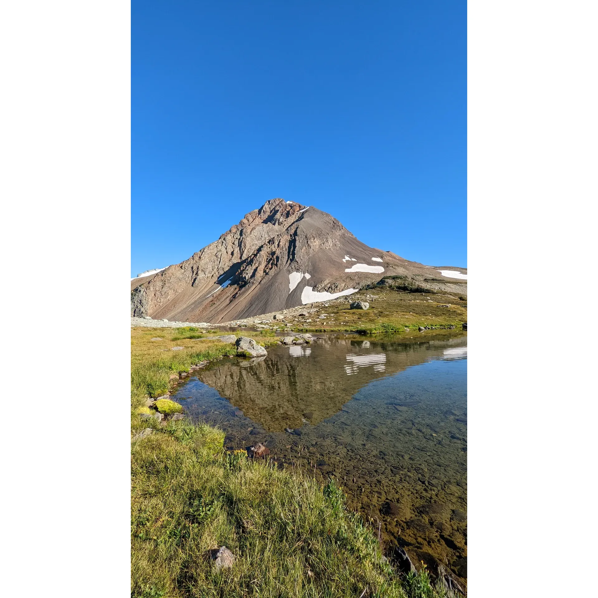 Escape to the pristine splendor of Garibaldi Park's well-loved backcountry retreat at Russet Lake, a destination renowned for its breathtaking panoramas and a true wilderness experience. This scenic campground is a haven for outdoor enthusiasts eager to immeraka e themselves in nature's grandeur.

Framed by magnificent landscapes that captivate the senses, Russet Lake's campground is thoughtfully equipped with an outhouse and a modernized bear cache system, ensuring a harmonious balance with the natural fauna. Adventure seekers will find solace in one of the twenty thoughtfully positioned tent spots, each fortified with rock barriers to shield from the brisk alpine gusts, with some winds having been recorded at exhilarating speeds of up to 80km/h—testimony to the area's untamed spirit.

Guests are often drawn to the campground via the mesmerizing trail of Singing Pass, which offers a challenging yet rewarding journey of approximately 15 km with a vertical gain of 1300m, starting from the accessible parking lot number 4. The return can be equally mesmerizing via the Musical Bumps trail, boasting views so stunning they invigorate the soul, complete with an invigorating descent for the final 6km stretch.

For those wishing to deepen their connection with the environment, Russet Lake is the perfect backdrop for a sunset that paints the sky with hues of fire and tranquility. The campground's proximity to the bear cache and outhouse adds convenience without detracting from the rustic charm of the setting.

Visitors desiring a less strenuous route may opt to reach Russet Lake by a journey that begins with the Blackcomb Gondola, transitioning to the Peak to Peak gondola across Whistler Mountain, and culminating in a hike over the Musical Bumps. This route, taking about 4-5 hours, offers a panorama of ethereal beauty, though it does require a Whistler Blackcomb sightseeing ticket. Conversely, the path can be reversed, avoiding the necessity of the Gondola fee.

Immerse yourself in the solitude of Russet Lake, an enclave of tranquility where the only footprints you’ll see are likely your own. Come prepared to carry in—and out—everything you require, including your shelter and supplies, embracing a leave-no-tract philosophy that entwines adventure with environmental stewardship. For those mindful of the rules, a booking with BC parks is essential to secure this unique camping experience; a small concession for the remarkable memories awaiting at Russet Lake. Description by ChatGPT.