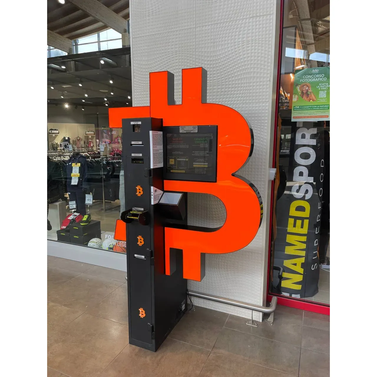 Bancomat Bitcoin ATM by Shitcoins.club is a premier destination for seamless cryptocurrency transactions. Renowned for its user-friendly interface, this state-of-the-art Bitcoin ATM enables quick and efficient cash deposits, turning fiat currency into digital assets with ease. Customers appreciate the convenience of transforming their cash into cryptocurrencies in real-time, ensuring their digital wallets are funded without delay.

The ATM supports a variety of popular cryptocurrencies, allowing patrons to diversify their portfolio without the need to navigate complex online exchanges. Transactions at Bancomat are praised for their speed, with many users reporting that depositing cash into their crypto wallet can be completed within minutes. The simplicity and efficiency of the service are consistently highlighted in customer experiences.

With security at the forefront, Shitcoins.club provides a trustworthy environment for both new and experienced users looking to enter the world of crypto. Furthermore, the ATM's strategic placement ensures accessibility and ease of use for anyone looking to invest in cryptocurrencies. Whether you are making your first purchase or you're an avid crypto enthusiast, Bancomat Bitcoin ATM by Shitcoins.club stands out as a reliable and expedient choice for managing your digital currency needs. Description by ChatGPT.