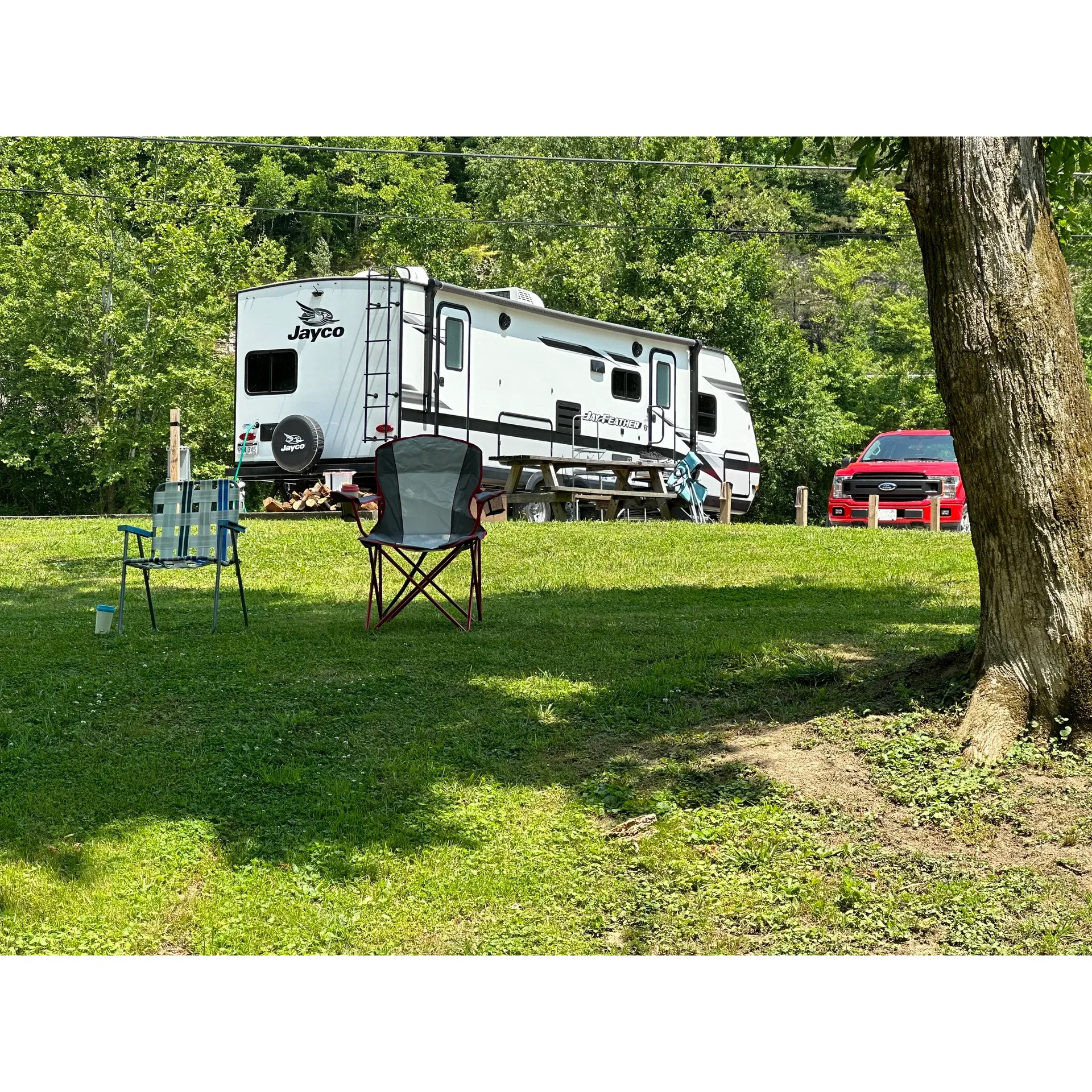 Welcome to the scenic 119 Rivers Edge Campground, where the essence of outdoor hospitality and the splendor of nature come together to provide an exceptional camping experience. Catering to outdoor enthusiasts and families alike, the campground proudly offers an array-serviced sites, complete with picnic tables and fire rings to enhance the joy of al fresco dining and evening bonfires under the stars.

Situated conveniently close to the Ivy Branch trail system and the Little Coal River, it's a prime location for guests looking to indulge in ATV adventures or serene kayak excursions. The grounds feature easy-to-navigate gravel roads, ensuring smooth access to all amenities, including well-maintained men's and women's restrooms and a designated area for dog walking, catering to pet owners with the utmost consideration.

The heartwarming hospitality provided by JR, who is dedicated to upkeeping the campground, personifies the campground's commitment to guest satisfaction. His willingness to offer guided tours of the trails, and aid with directions and suggestions, reflects the level of personalized service that guests can expect to receive.

The campground boasts full hookup sites that accommodate both short-term visitors and seasonal dwellers, demonstrating versatility and a welcoming atmosphere to all. Connectivity needs are met with reliable WiFi service, and a communal bathhouse is available for those who require it. Additionally, the proximity to the Hatfield McCoy welcome center makes it a convenient stop for trail system enthusiasts.

For those seeking tranquility coupled with the ease of access right off the highway, without the need for back-road driving, 119 Rivers Edge Campground emerges as an ideal locale. Not only do guests commend the neatly groomed grounds and peaceful river views, but they also appreciate the commendable service offered by the owners and staff. Whether you're passing through Madison, WV, or planning an extended outdoor retreat, this campground is celebrated as a home away from home by many who vow to return for more memorable experiences. Description by ChatGPT.