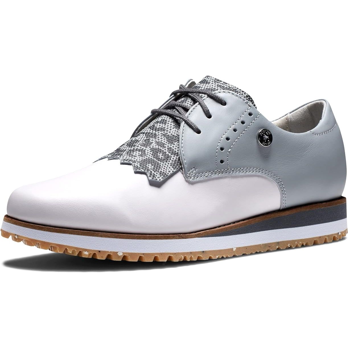 The FootJoy Women's Sport Retro golf shoe is a previous season style that offers a blend of modern performance and retro styling. This shoe features a lightweight construction with a breathable mesh upper that provides comfort and breathability on the course.